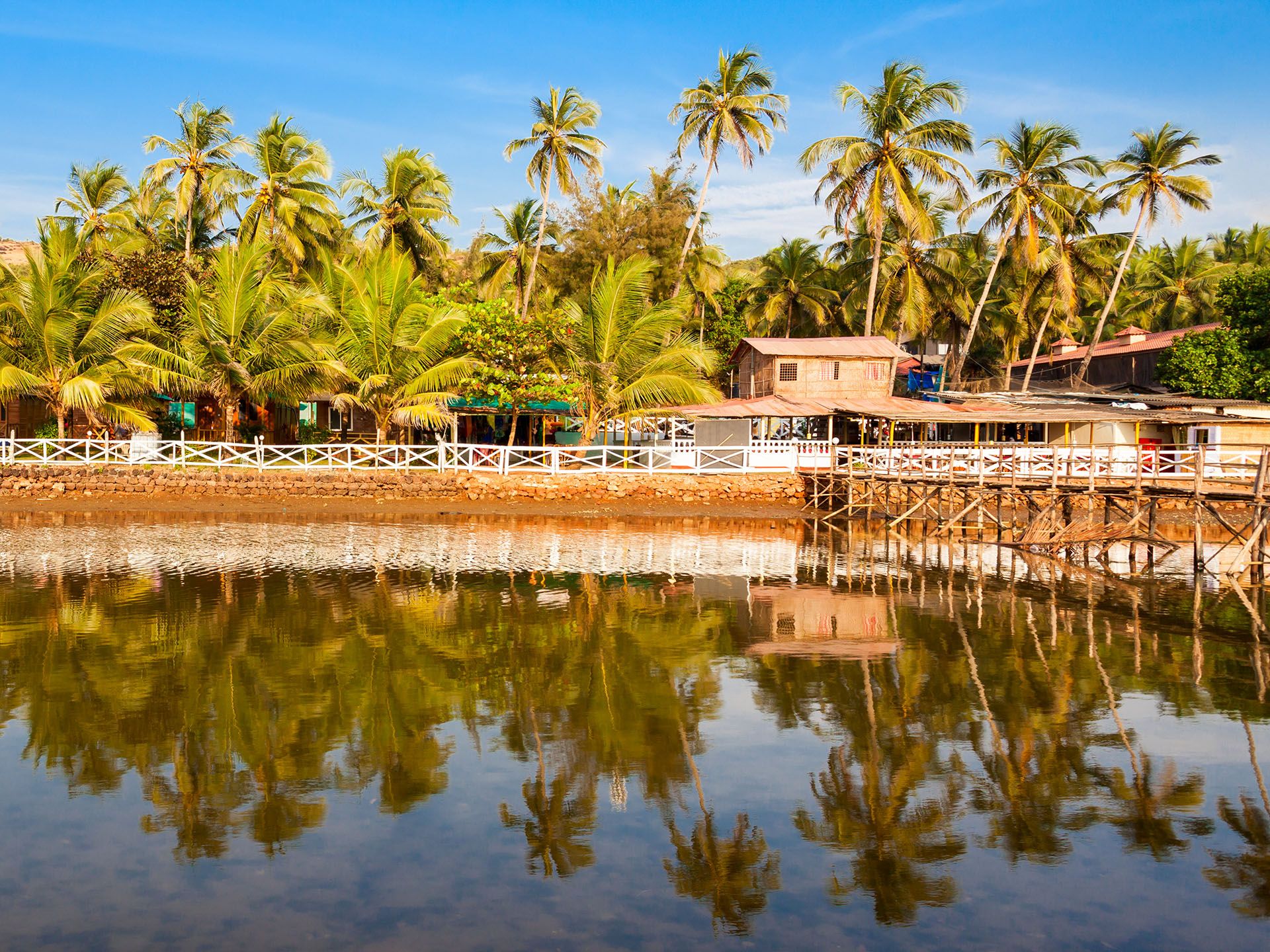 Resort huts on Mandrem beach in north Goa, India © saiko3p/Shutterstock
